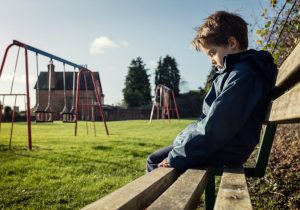 Sad child in park