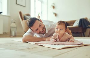 Father crawling with baby